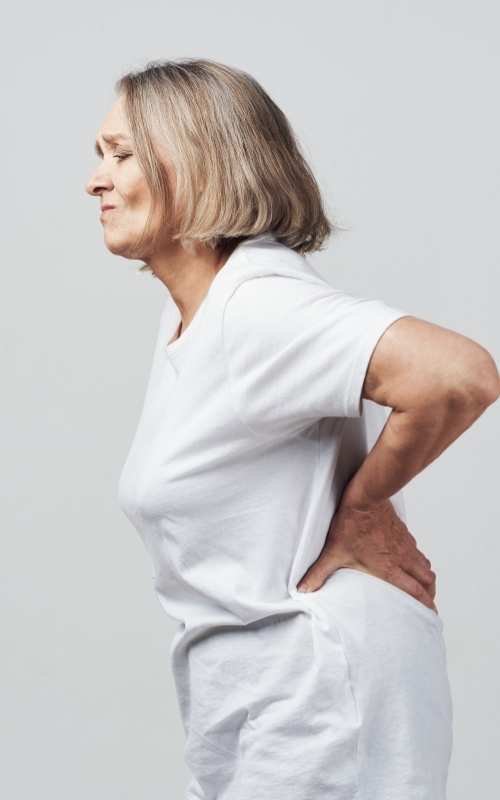 Private osteopath appointment Lady with back pain